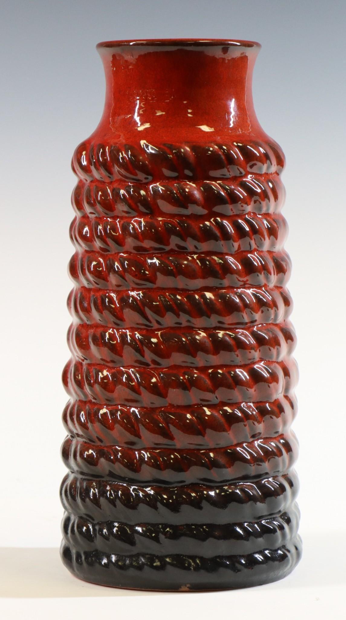 Carstens Tonnieshof (1945 - 1987): Earthenware vase with slightly flared lip, "rope-like" surface and glazed red and black. Marked on bottom "W. Germany 7742-30". 12"h x 5" round