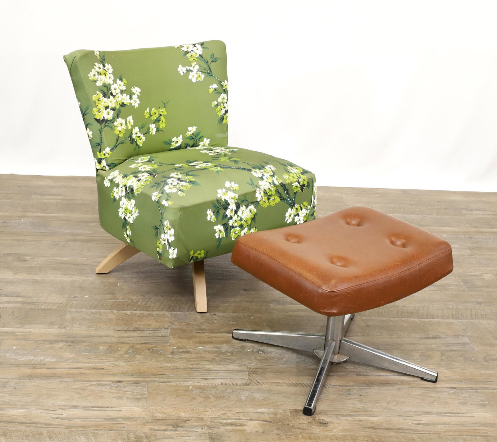 Modernist Slipper Chair with Swedish Ottoman: Chair having beige painted splayed legs with floral textured fabric, 29"h x 24"w x 24"d, seat height of 17". Swedfurn brown leather ottoman, 15"h x 20"w x 15"d **Please Note: This item is NOT eligible
