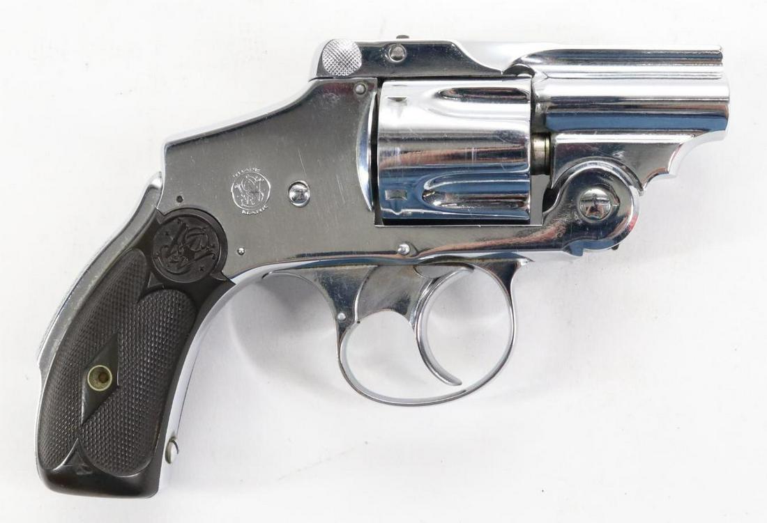 Smith & Wesson Safety Hammerless (Lemon Squeezer) Double Action Revolver: 38 S&W, 1 5/8" cut down barrel, SN 168585. 98% nickel finish shows average handling, good bore, barrel has been cut short taking the front sight, checkered diamond pattern plastic grips show average h