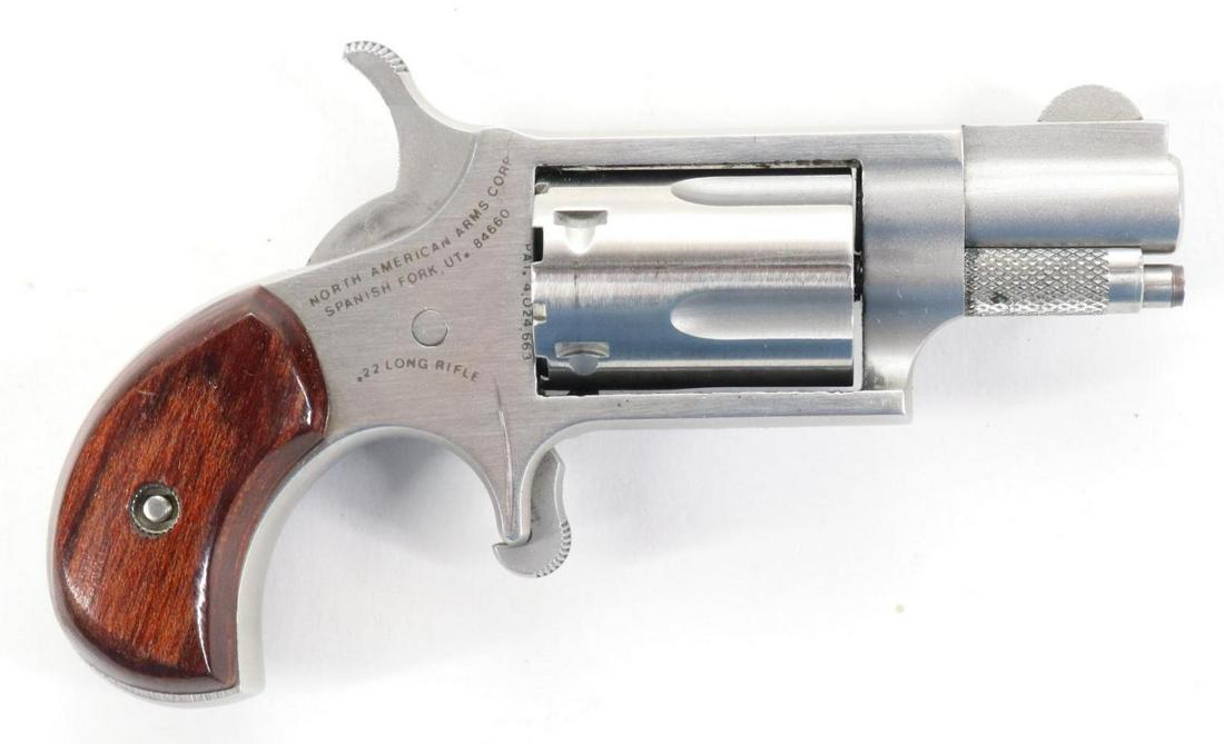 North American Arms Mini Revolver: 22LR, 1 1/8" bbl, SN V87381. Matte stainless shows no handling, good bore, wood birds head grips show no handling with additional holster/grip with instructions and leather holster. Very good conditio