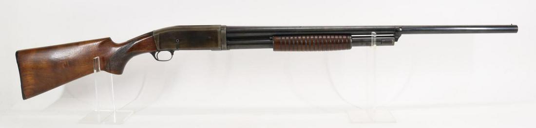 Remington Model 10-A Pump Action Shotgun: 12Ga. 28 3/4" bbl, Full choke, SN U170791. Dark brown/gray patina, good bore, checkered wood stock and ribbed forearm show moderate handling with older home refinish and crack on both sides of wrist,