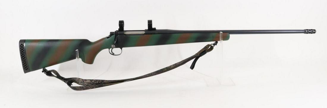 Ultra Light Arms Model 28 Bolt Action Rifle: 300 Win Mag, 25 1/2" bbl with integral muzzle brake, SN 87-127. 98% blue finish shows average handling with a few small scratches near muzzle, good bore, jeweled bolt, Weaver style scope rings and mou