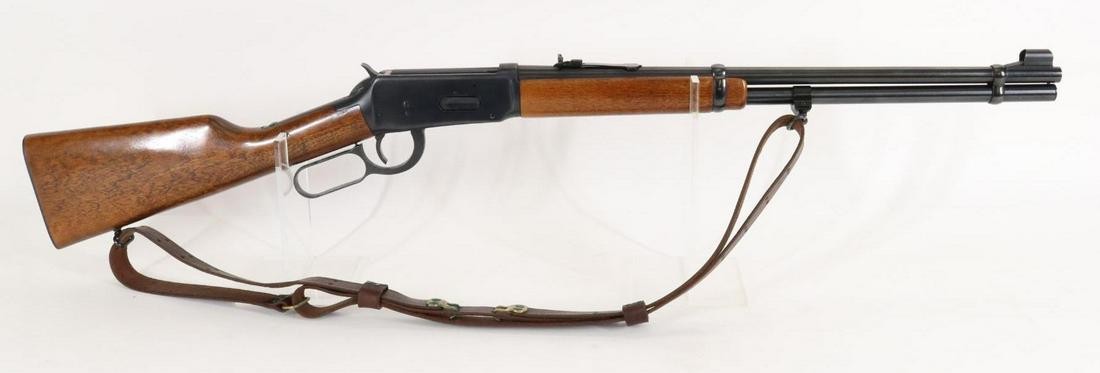 Winchester Model 94 Lever Action Rifle: 30-30 Win, 20" bbl, SN 2916329. 98% blue finish shows average handling with a few light scratches on barrel, good bore, wood stock and forearm show light/average handling with leather sling. 13 1/4" L