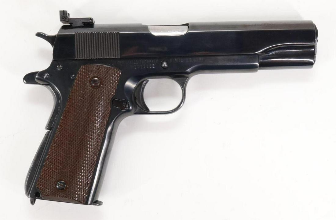 Remington Rand 1911A1 Semi Automatic Pistol: 45 Auto, 5" bbl, SN 1015182. 99% thick reblue making the stampings hard to read, good bore, replacement rear sight, missing front sight, frame marked FJA on left side for (Frank J Atwood inspector) ri