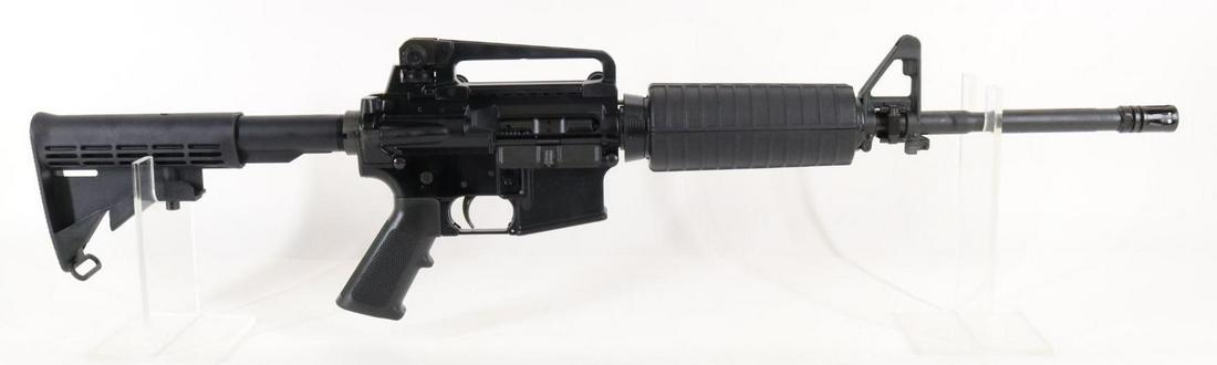 Colt Law Enforcement Carbine Model LE6920 Semi Automatic Rifle: 5.56mm, 17 1/2" bbl with flash suppressor, SN LE052735. 100% matte black finish, very good bore, carry handle rear sight, left side of magazine well marked Restricted Military/Government Law Enforceme