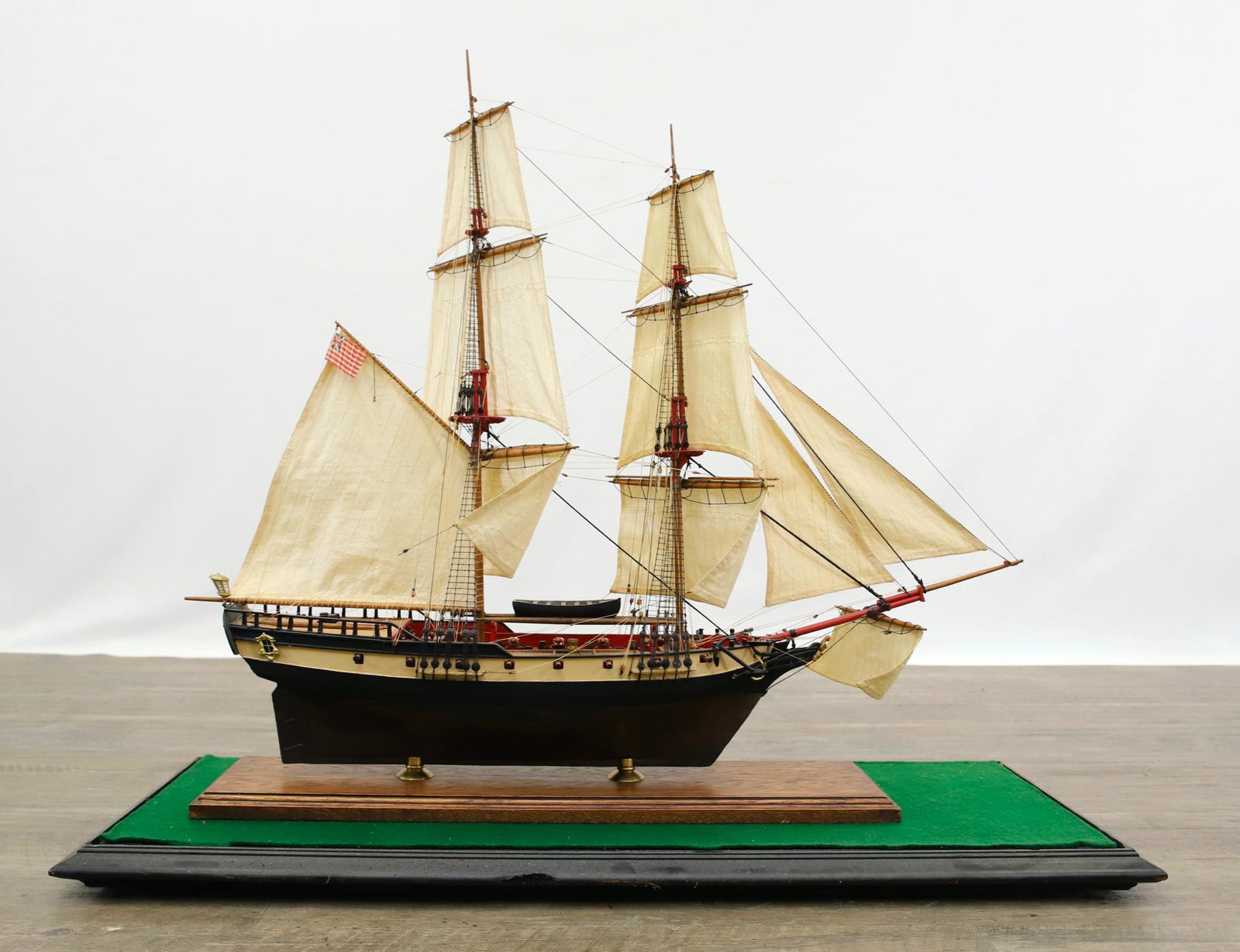 "Fair American" Revolutionary War Brig Ship Model: Hand built, copper hull, 14 gun brig. Encased in a glass case. Ship 24"h x 28"w, case 27"h x 30"w x 11"d, **Please Note: This item is NOT eligible for in-house shipping. Please refer to the terms and 