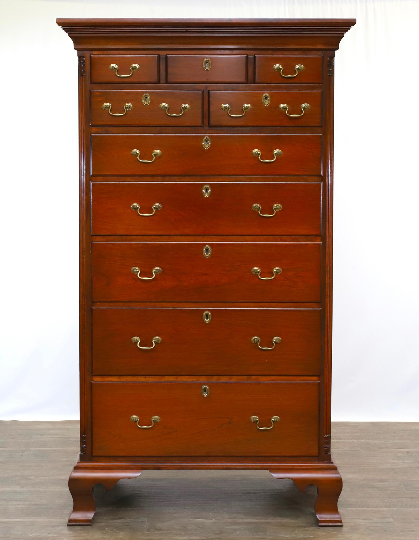 Robert Johnson Bucks County Bench-Made Tall Chest: Dovetail and peg construction. Solid cherry having a molded cornice, one over two over five graduated drawers on ogee bracket feet. Signed maker's mark stamped in drawer. 72"h x 41.5"w x 23.5"d **Plea