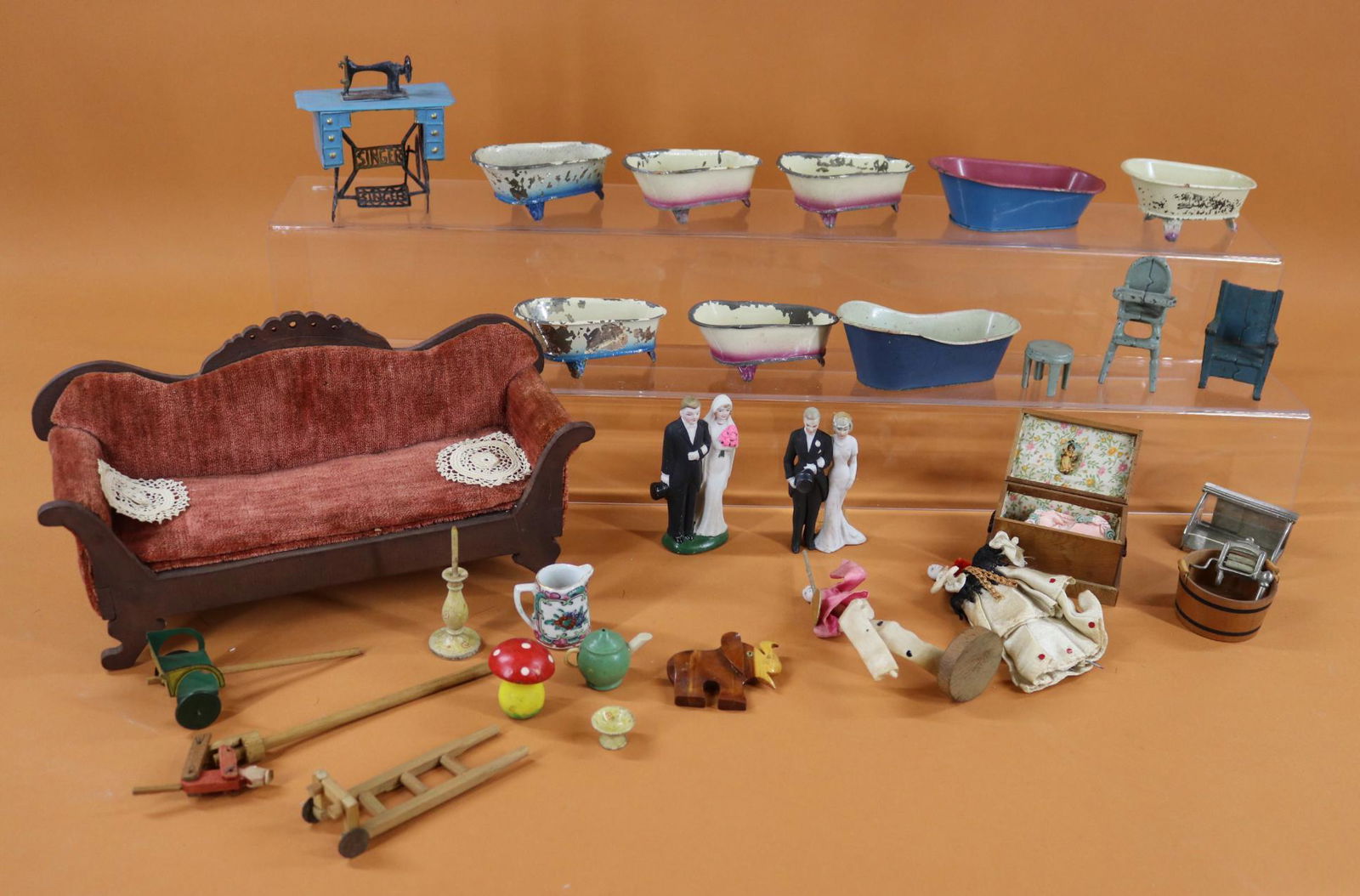MINIATURES/DOLLS/FURNITURE.: LOT. Dolls - novelty with parian heads. Figurines - (2) Pairs of bisque bride/grooms - Germany, Occupied Japan. Miniatures - (8) German tin bathtubs. Tin Singer sewing machine. Tin Cracker Jack toy. A