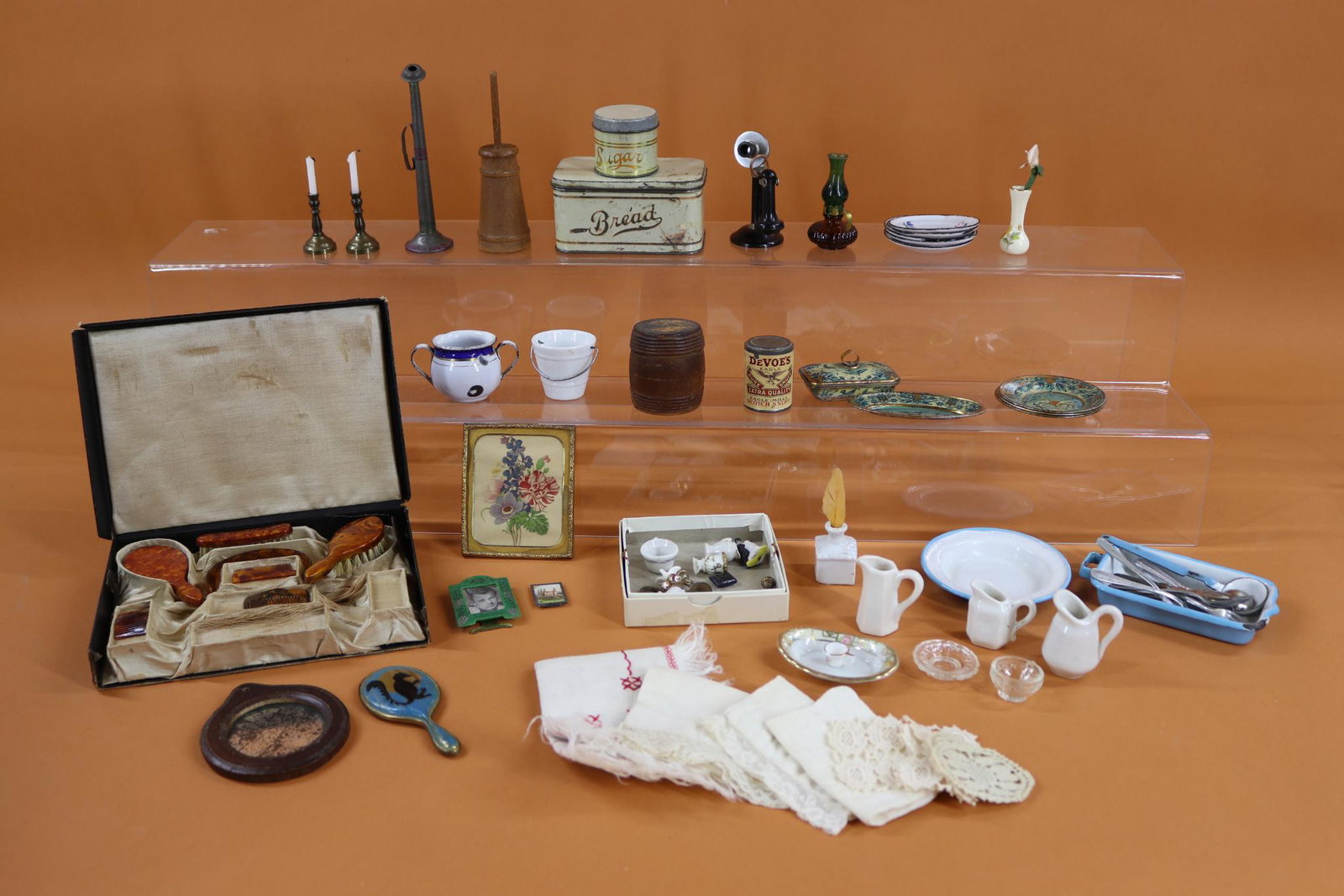 MINIATURES.: LOT. Antique china, tinware, enamelware, flatware, framed items, linens, glass, wood, oil lamp/candles, cast iron telephone. Celluloid dresser set in OB. Condition: age loss, discoloration. This lot i