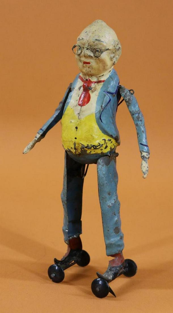 TOY(S).: 8" T. GUNTHERMANN FOXY GRANDPA. Painted tin figure with clockwork mechanism. Classic comic character from the early 20th c. When wound, he does splits and raises his arms. Condition: in good working o