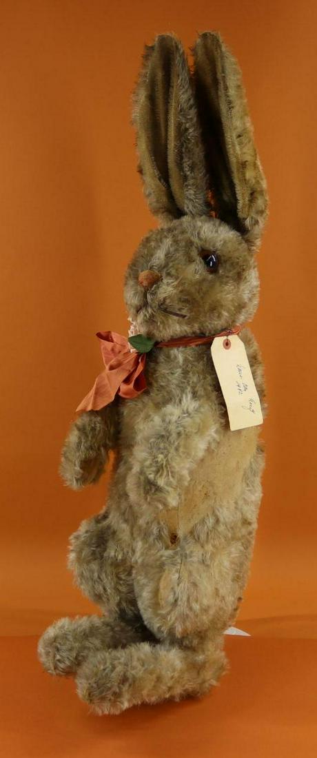 ANTIQUE STEIFF.: Early (1920's?) 34" Display size Mohair Sitting Rabbit. Silver button, Steiff in upper case, second "F" extended into a long arc. 1 5/8" Brown glass eyes, embroidered red nose. Swivel neck. Comes with