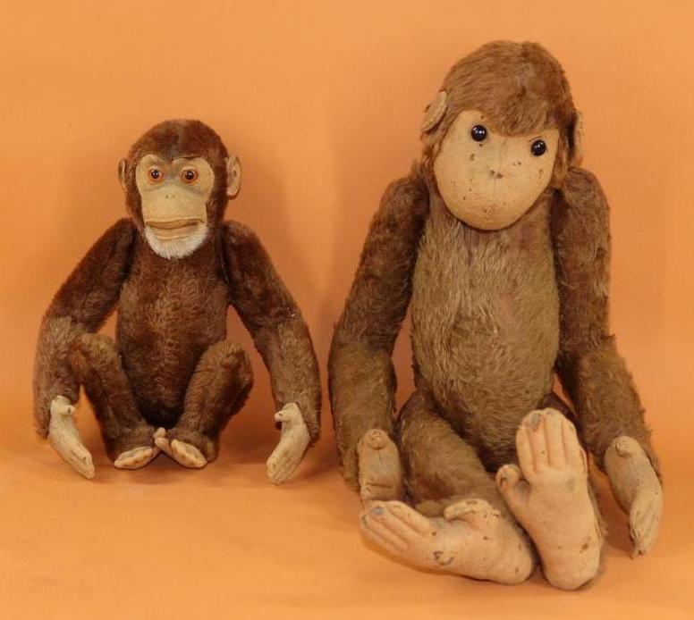 ANTIQUE STEIFF.: Pair of early (pre and 1920's?) brown mohair plush MONKEYS. Both are fully jointed with felt faces, ears, hands and feet. 24" Unmarked "Affe" with large black shoe button eyes. The left ear has the ho