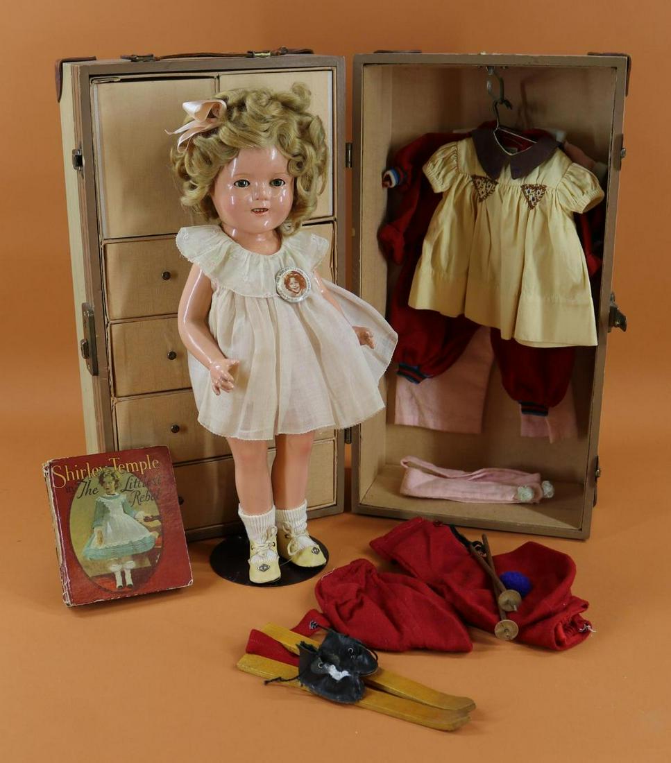 SHIRLEY TEMPLE.: LOT. 17" Ideal composition doll with original mohair wig. Doll comes with some factory clothing. Tagged organdy dress, shoes. Moll-ey's tagged 3 pc. ski outfit with skis/poles. PJ's. Also unmarked dre