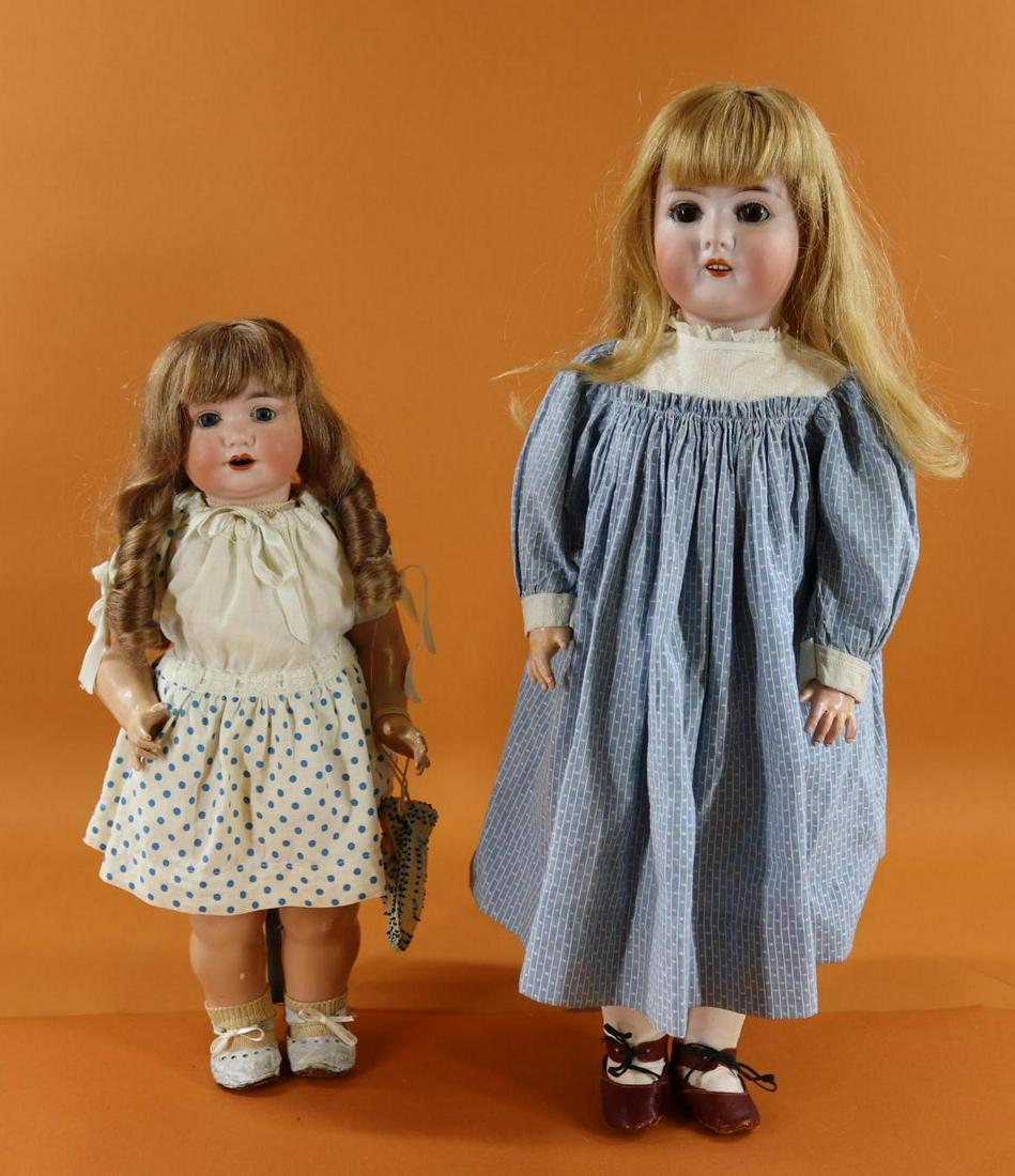 GERMAN BISQUE HEAD DOLL(S).: Pair of ARMAND MARSEILLE Dolls. Both dolls have open mouths, French human hair wigs and are dressed in vintage/antique clothing, leather shoes. 17 1/2" GERMANY 971 A.3.M. DGRM Character Toddler with s