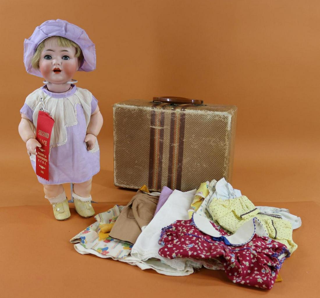 GERMAN BISQUE HEAD DOLL & WARDROBE.: 16" P SIMON & HALBIG 122P 36 GERMANY Walking Toddler Character Doll with Wardrobe. Blue sleep eyes, open mouth, blonde human hair wig. Papier mache body with jointed arms, 1 pc. legs. Doll come with a