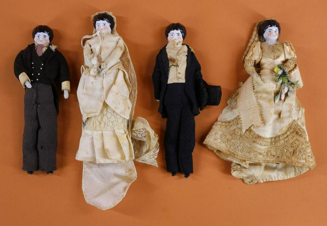 CHINA HEAD DOLL(S).: Lot of (4) antique 7" Low Brows. (2) Grooms and (2) Brides. All have black hair, unglazed lower limbs with painted heeled shoes. Dressed in antique clothing. Condition: age loss, discoloration on clot