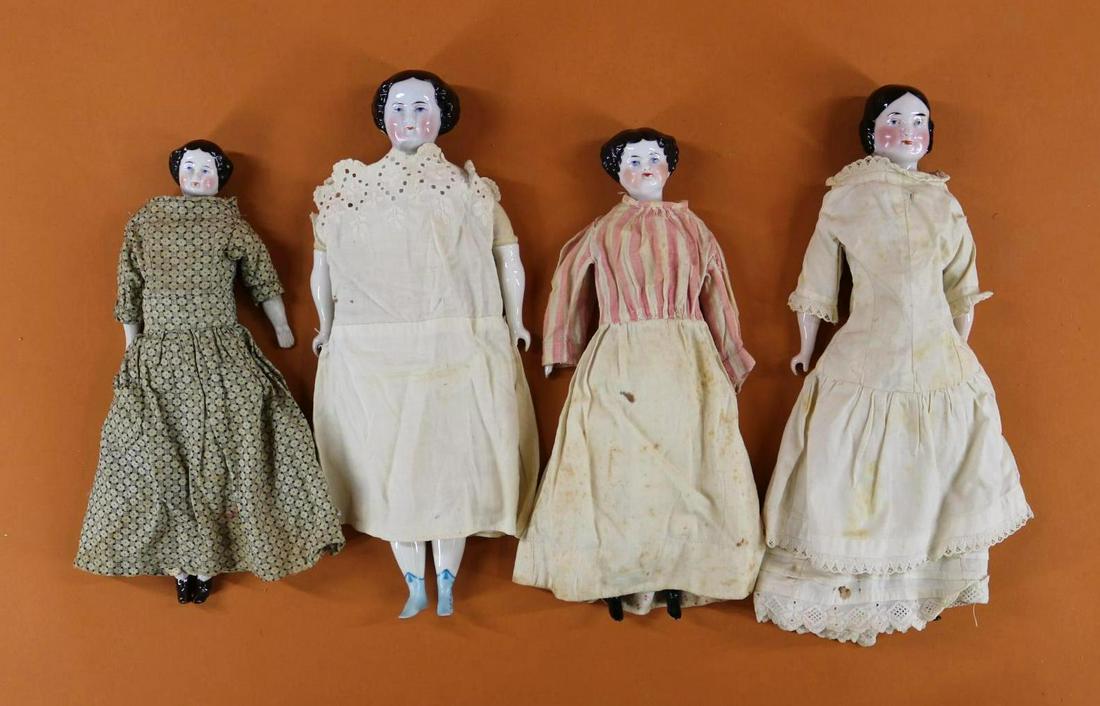 CHINA HEAD DOLL(S).: Lot of (4) antique dolls with black center part hair, blue eyes. All of them have some antique cotton clothing, underwear. 12" Doll with 1860's style hair has a vintage cloth body with Humpty Dumpty D