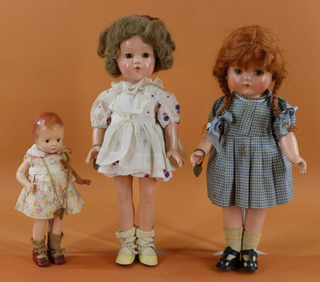 EFFANBEE FAMILY DOLLS.: LOT of (3) dolls. 9" "Patsyette" doll - painted brown eyes, red hair. All original clothing, oilcloth shoes, brass heart necklace. 14" "Patricia" doll - green sleep eyes, red braided mohair wig. All o
