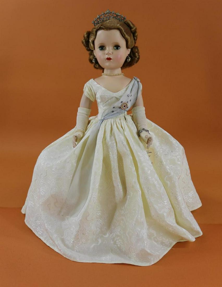 1940's-1960's HARD PLASTIC DOLLS.: 18" 1953 Tagged Madame Alexander "Queen" with the Margaret face. All original doll with the beautiful uncombed honey blonde wig. White gown with blue sash (faded) . Crown, earrings, bracelet. Hoop ski