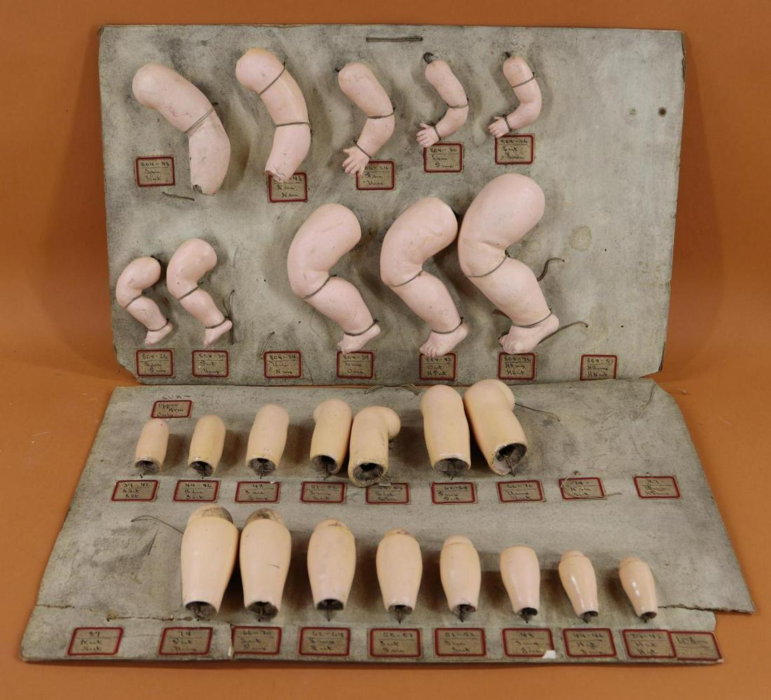 SALESMAN'S SAMPLE CARD(S) - GERMAN BODY PARTS.: LOT of (2) cards of German papier mache parts from a 1930's Philadelphia doll hospital. Card 1 BABY - (5) bent knee left LEGS 3 1/2" - 7" (2-are missing). (3) 1 Pc. left ARMS 3" - 4". (2) 2 Pc. left A
