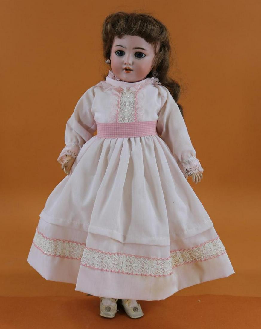 GERMAN BISQUE HEAD DOLL.: 18" S & H 1249 DEP GERMANY 6 1/2 doll with blue sleep eyes, open mouth, pierced ears, synthetic wig. Papier mache ball jointed body. Dressed in newer clothing, antique oilcloth shoes. Condition: flake