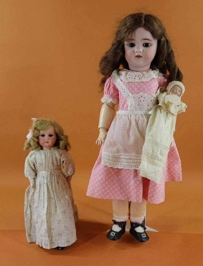 GERMAN BISQUE HEAD DOLL(S).: LOT of (3) dolls. Big sister - 24" 1079 SIMON & HALBIG S & H GERMANY doll with brown sleep eyes, open mouth, pierced ears brown human hair wig. Papier mache ball jointed body. Dressed in vintage cloth