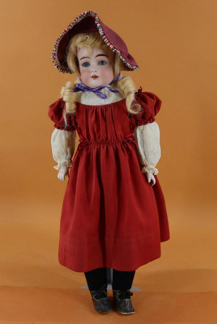 GERMAN BISQUE HEAD DOLL.: 19" 8 147 D MADE IN GERMANY shoulder head doll with blue sleep eyes, open mouth, strawberry blonde human hair wig, plaster pate. Leather gusseted body with bisque lower arms. Dressed in antique clothi