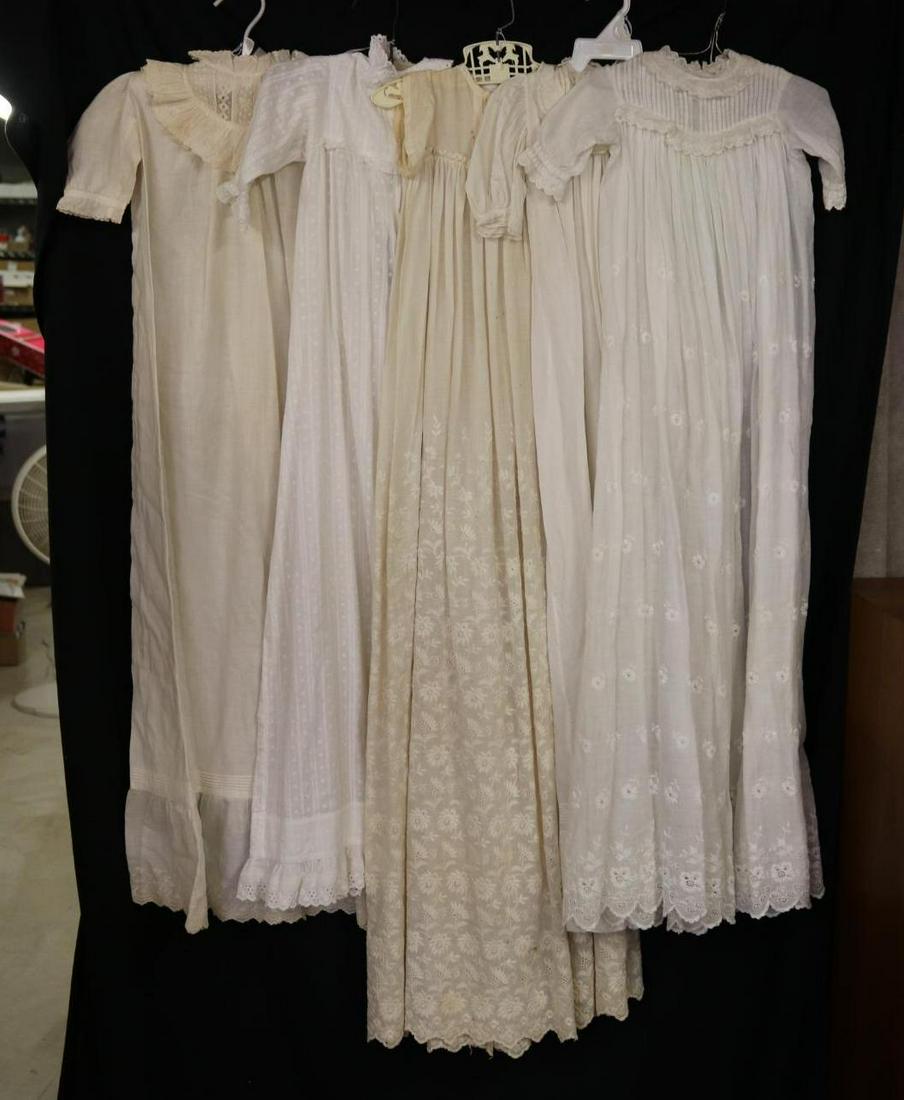 ANTIQUE CLOTHING.: LOT of antique white cotton baby gowns. They may be made from embroidered fabric, woven dots. They have fancy yokes with pin tucks, lace, eyelet. Condition: age discoloration, loss. This lot is being 