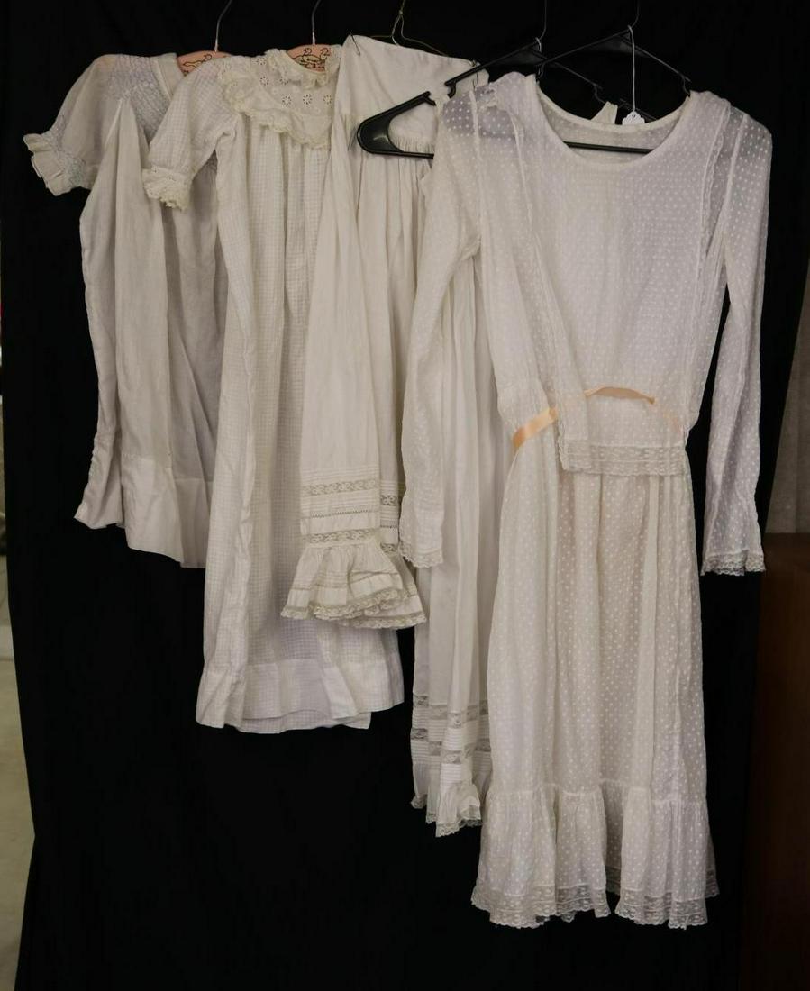 ANTIQUE CLOTHING.: LOT of (5) antique white cotton items. Child's smocked dress 24" L. Baby's dimity christening gown with eyelet collar 31" L. Full petticoat for christening gown with lace and pintuck detail. 36" L. Ha