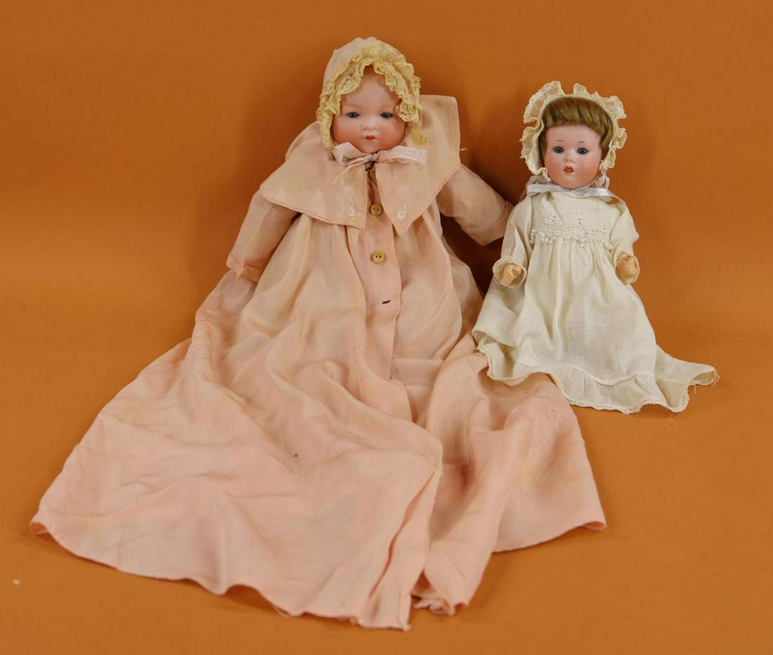 GERMAN BISQUE HEAD BABY DOLL(S).: Pair of Armand Marseille baby dolls with blue eyes. 10" 251 G.B. GERMANY A.4/0.M D.R.G.M. 248/1 character baby with stationary eyes, brown mohair wig, open/closed mouth. 5 Pc. papier mache bent limb b