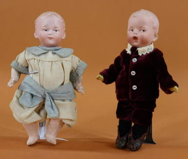 ANTIQUE BISQUE HEAD DOLLS, 12" UNDER.: Pair of HEUBACH Character dolls. Both dolls have solid domes with painted blonde hair, intaglio eyes, 5 pc. papier mache bodies. 7 1/2" 5 D 95(HEUBACH square)91 Baby with "fussy" face. Bent limb baby