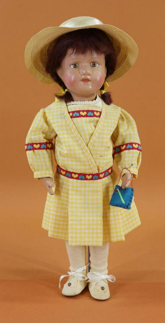 WOOD DOLL(S) - SCHOENHUT.: 15" Model No. 316 "Miss Dolly" with painted brown eyes, replaced henna mohair braided wig. Closed mouth with teeth showing. Marked with oval decal on back of torso. No original clothing, shoes. Dresse