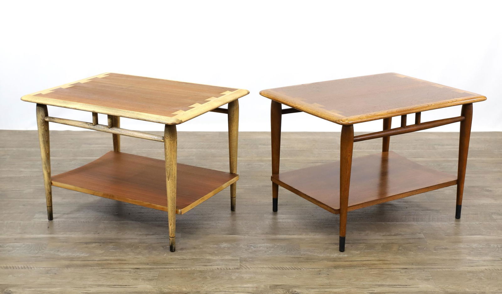 Andre Bus for Lane "Acclaim" End Tables: Pair of two-tier end tables, walnut with exposed dovetailing and tapered round legs, with different finishes. 20"h x 28"w x 21"d **Please Note: This item is NOT eligible for in-house shipping. Please