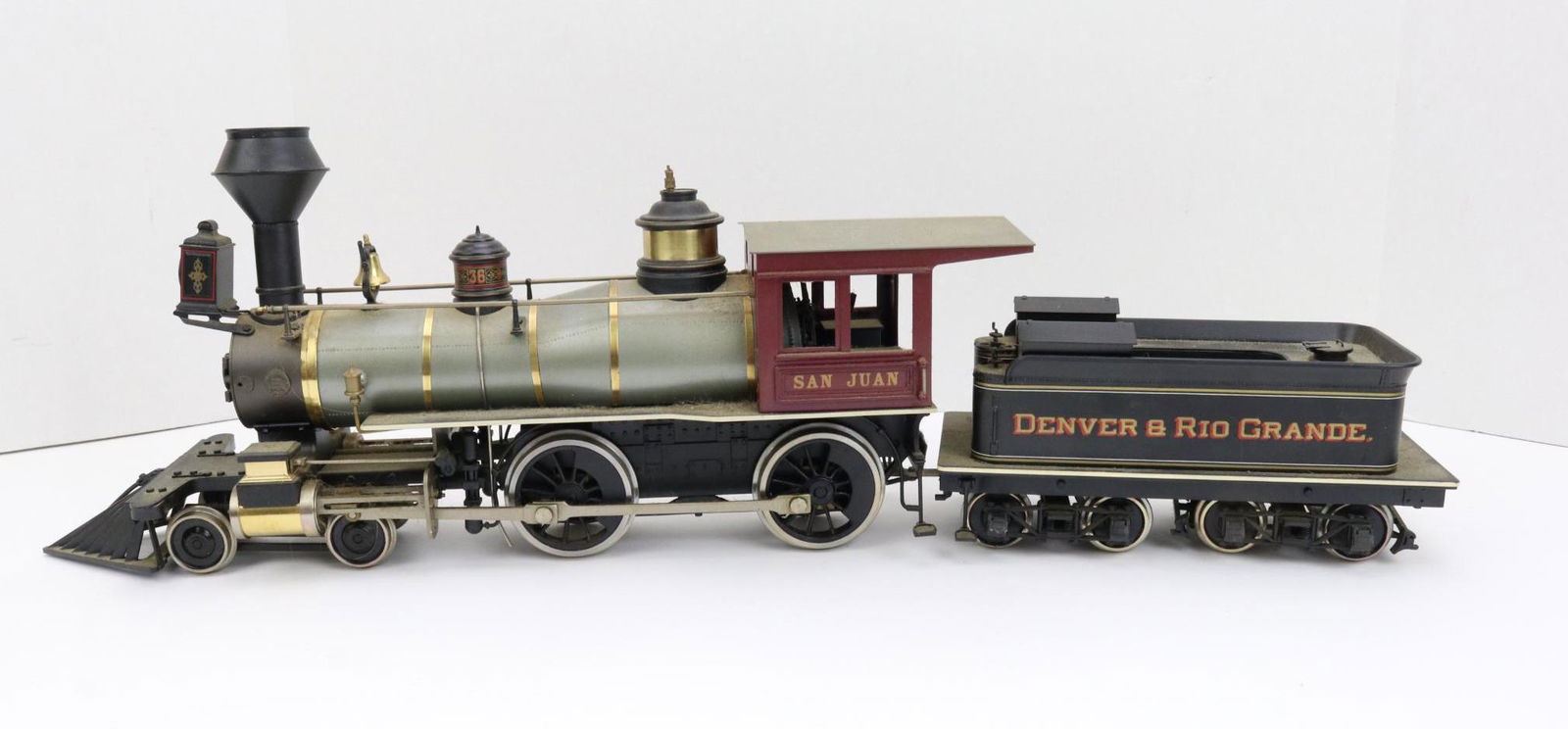 Accucraft Locomotive 36: O gauge, 2-rail, 4-2-2, San Juan steam locomotive with Denver & Rio Grande tender. Includes wooden box.