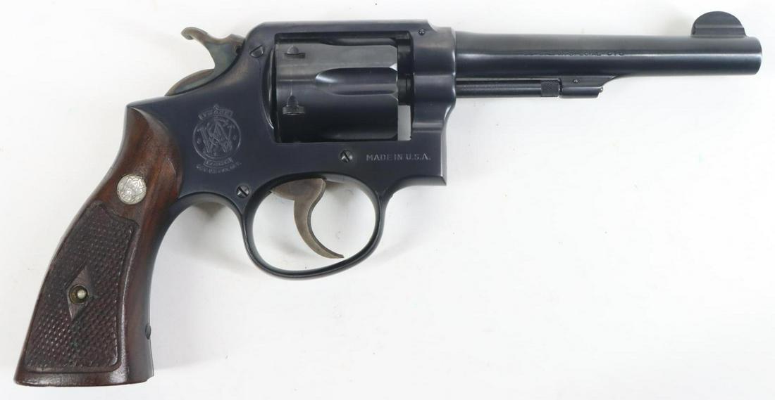 Smith & Wesson M&P Double Action Revolver: 38 Special, 5" bbl, SN S984232. 95% blue finish shows light handling with a few small abrasions on cylinder near rear edge and a few light freckles, good bore, 80% case color on narrow serrated hammer