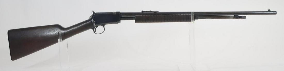 Winchester (Pre 64) Model 62A Takedown Pump Action Rifle: 22S,L,LR, 23" bbl, SN 293876. Dark brown patina, fair bore, wood stock and ribbed forearm show average handling with a deep scratch that looks like a crack on lower left side of forearm. Good conditio