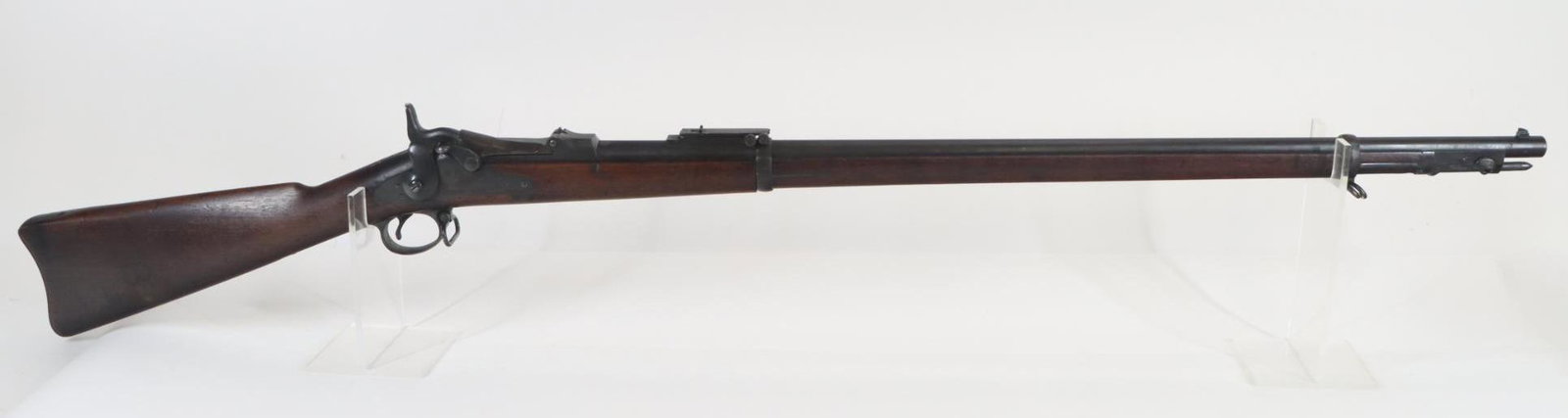 Springfield Model 1884 Trapdoor Rifle: 45-70, 32 1/2" bbl, SN 557247. dark brown patina on barrel and action, breech block shows 40% case color, very good bore, left side of breech marked with VP over eagle head P, breech block marked in t
