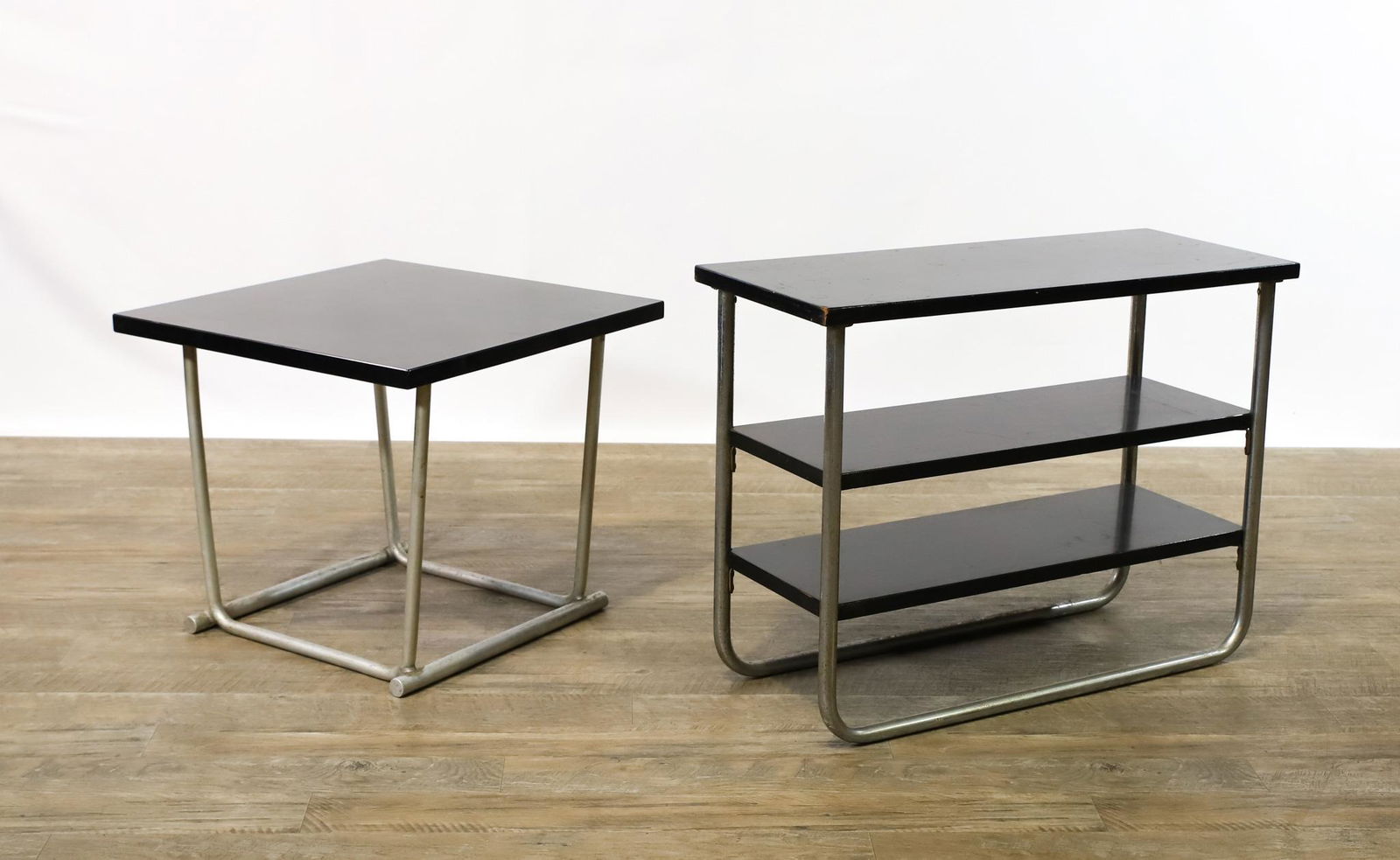 Wolfgang Hoffmann "Chromsteel" Shelf with Table: Tubular chrome and black lacquered wooden 3-tier shelf, Wolfgang Hoffmann design, labeled for W.H. Howell Co., 22"h x 30"w x 12"d. Complementing table with tapered welded tubular aluminum frame, unmar