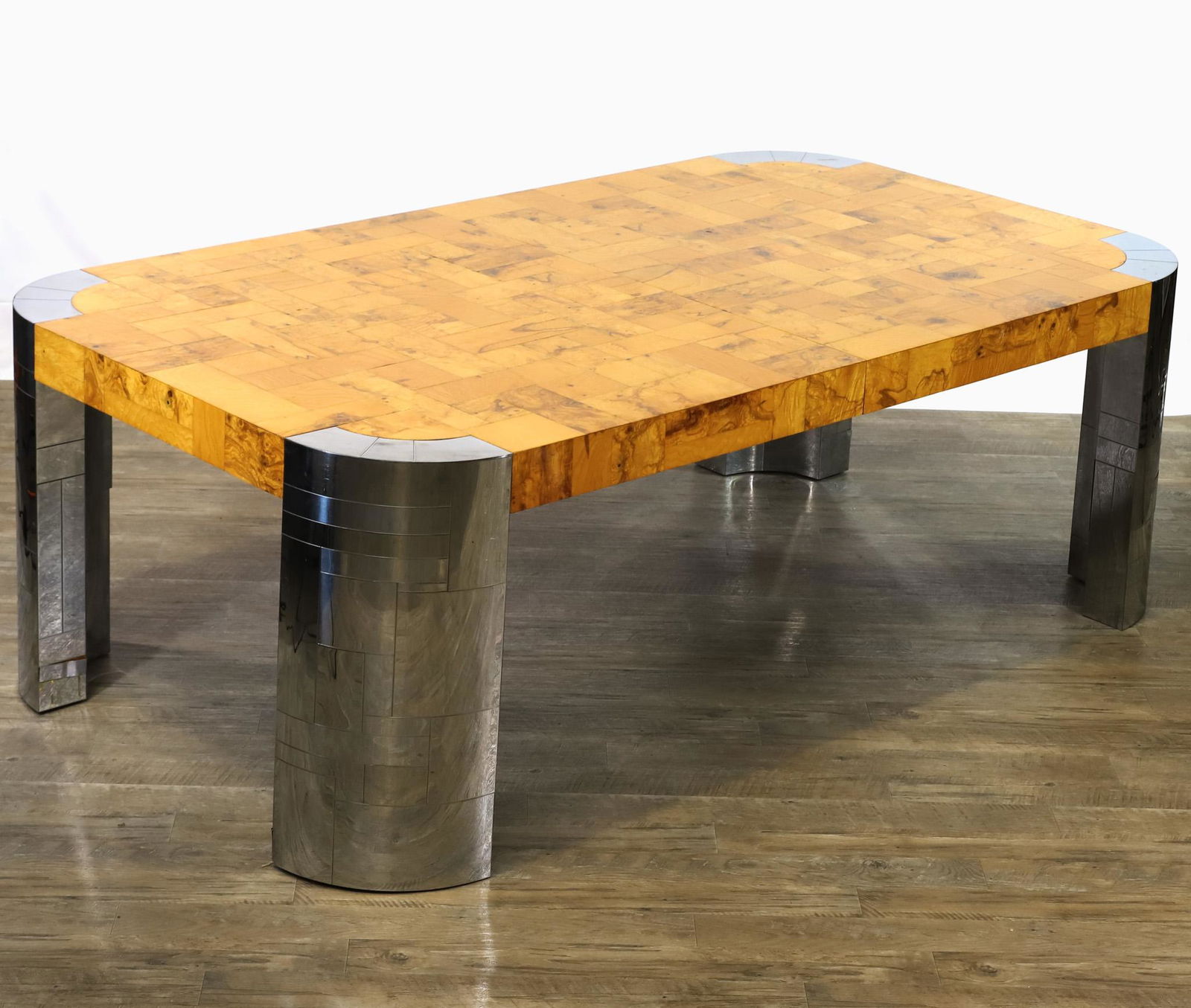 Paul Evans for Directional Cityscape Dining Table: Patchwork burl veneer top on patchwork polished steel veneer curved legs. Includes (2) leaves. Signed on one leg. One missing piece of steel veneer. There are some glued repairs to the veneer, areas o