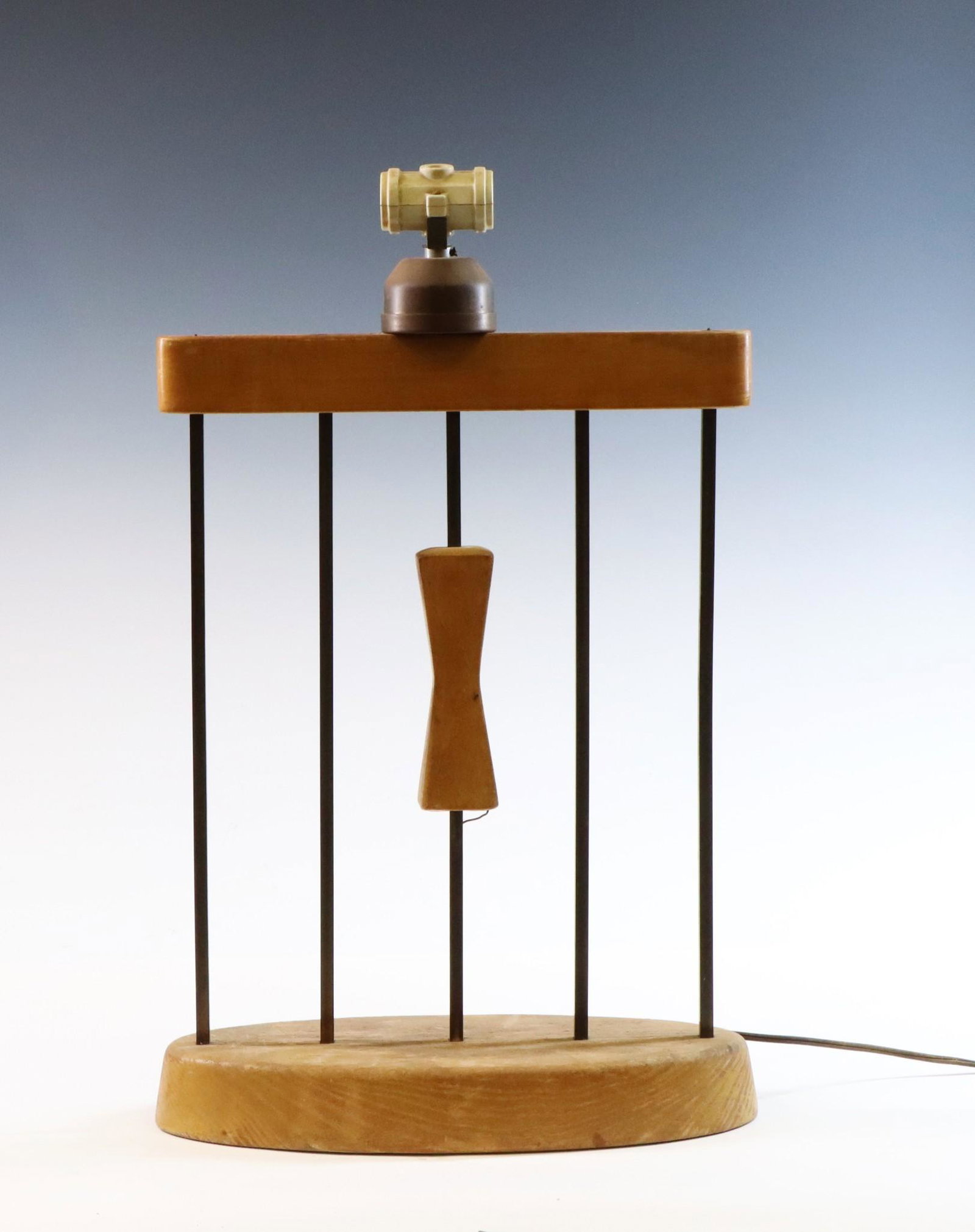 Table Lamp: Dual socket lamp with bow tie center adornment. Currently working but will need rewiring. 21.5"h x 13.5"w x 5.5"d **Please Note: This item is NOT eligible for in-house shipping. Please refer to the te