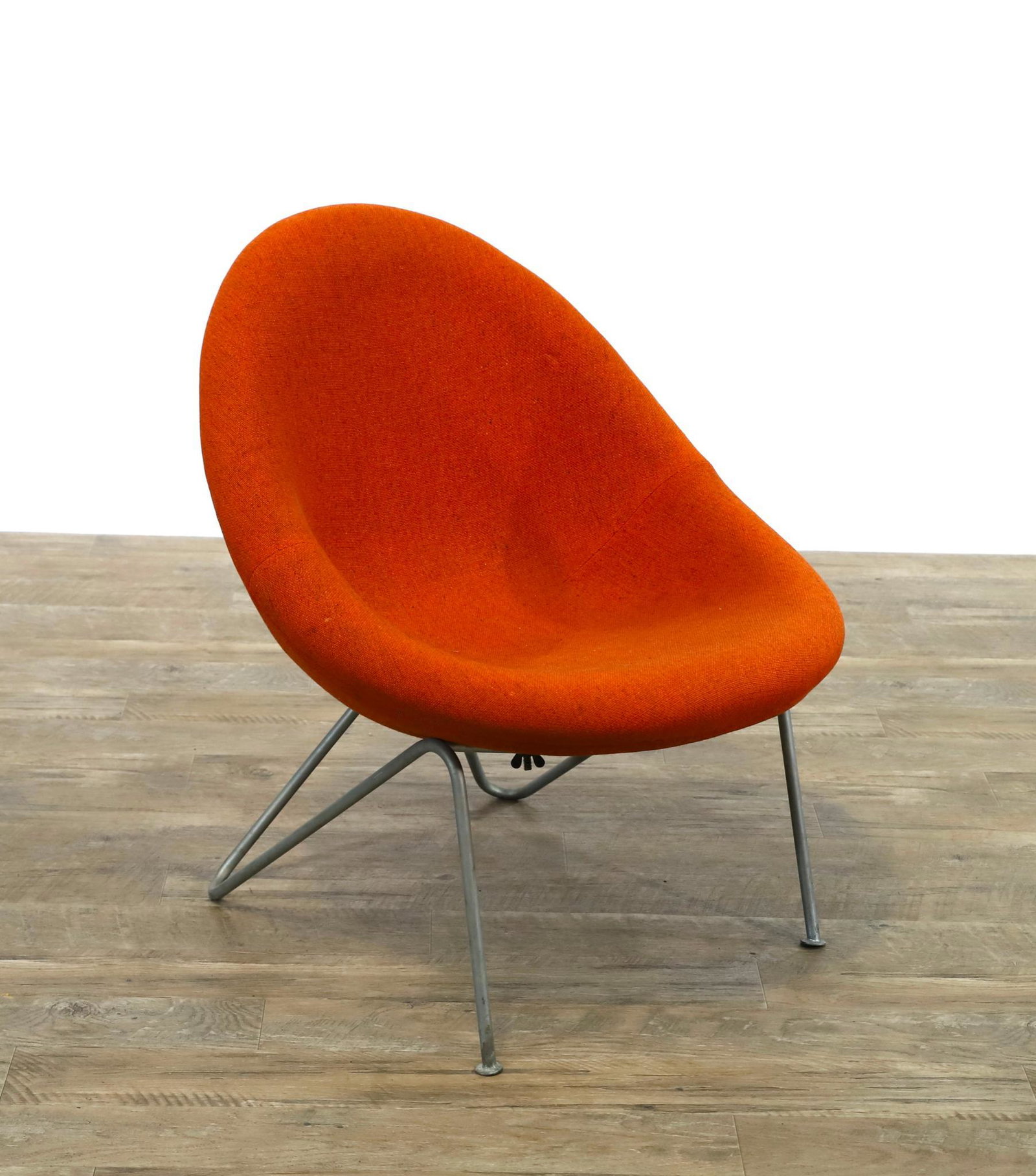 Circle Lounge Chair in the Manner of Pierre Paulin: Orange textured seat and back with a hairpin aluminum base. 27"h x 22.5"w x 21"d, seat height of 14" **Please Note: This item is NOT eligible for in-house shipping. Please refer to the terms and condi