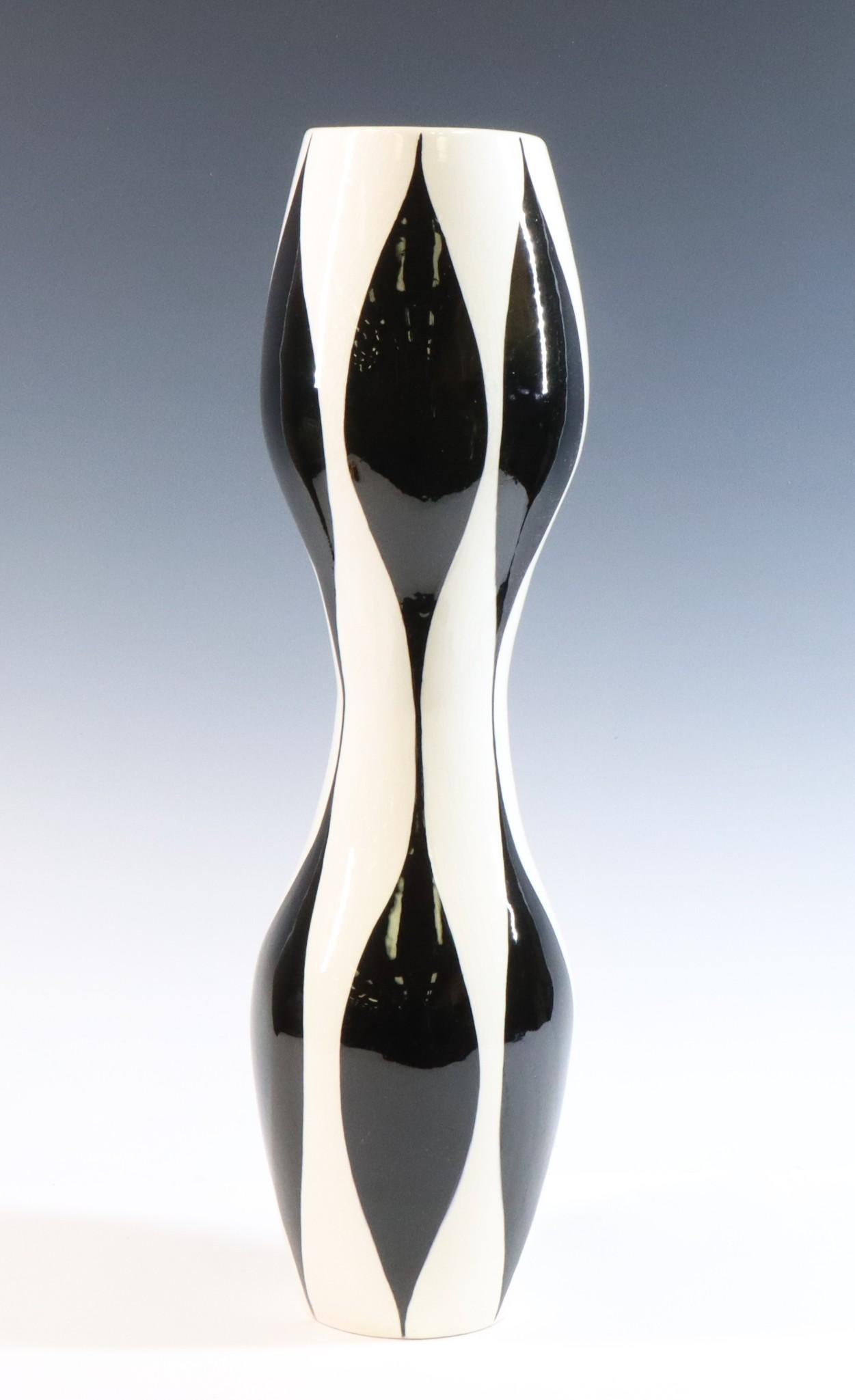 LaGardo Tackett Studio Pottery Vase: LaGardo Tackett Studio Pottery Vase. Earthenware glazed black and white vase, hour-glass form, unmarked. 21"h x 5.5" round **Please Note: This item is NOT eligible for in-house shipping. Please refer