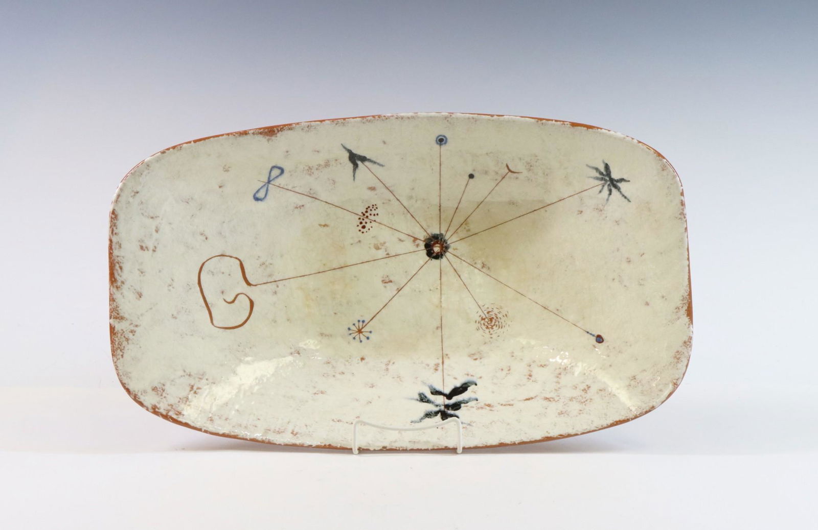 LaGardo Tackett Studio Pottery Bowl: Earthenware bowl/tray, unsigned. White glaze and decorated with simple abstract design. 3.5"h x 20"w x 11.75"d **Please Note: This item is NOT eligible for in-house shipping. Please refer to the terms