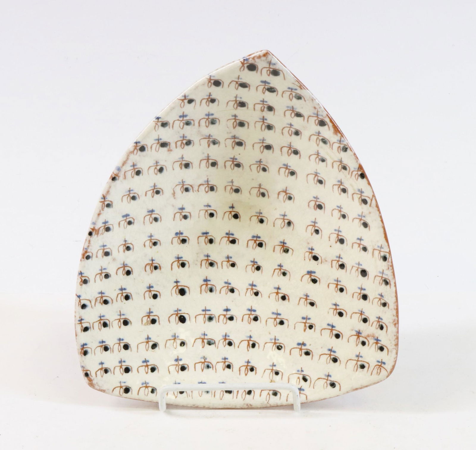 LaGardo Tackett Studio Pottery: LaGardo Tackett studio pottery, unmarked. Earthenware rounded three sided shallow bowl. White glaze with repeat abstract decoration. 7" length x 7"w **Please Note: This item is NOT eligible for in-hou