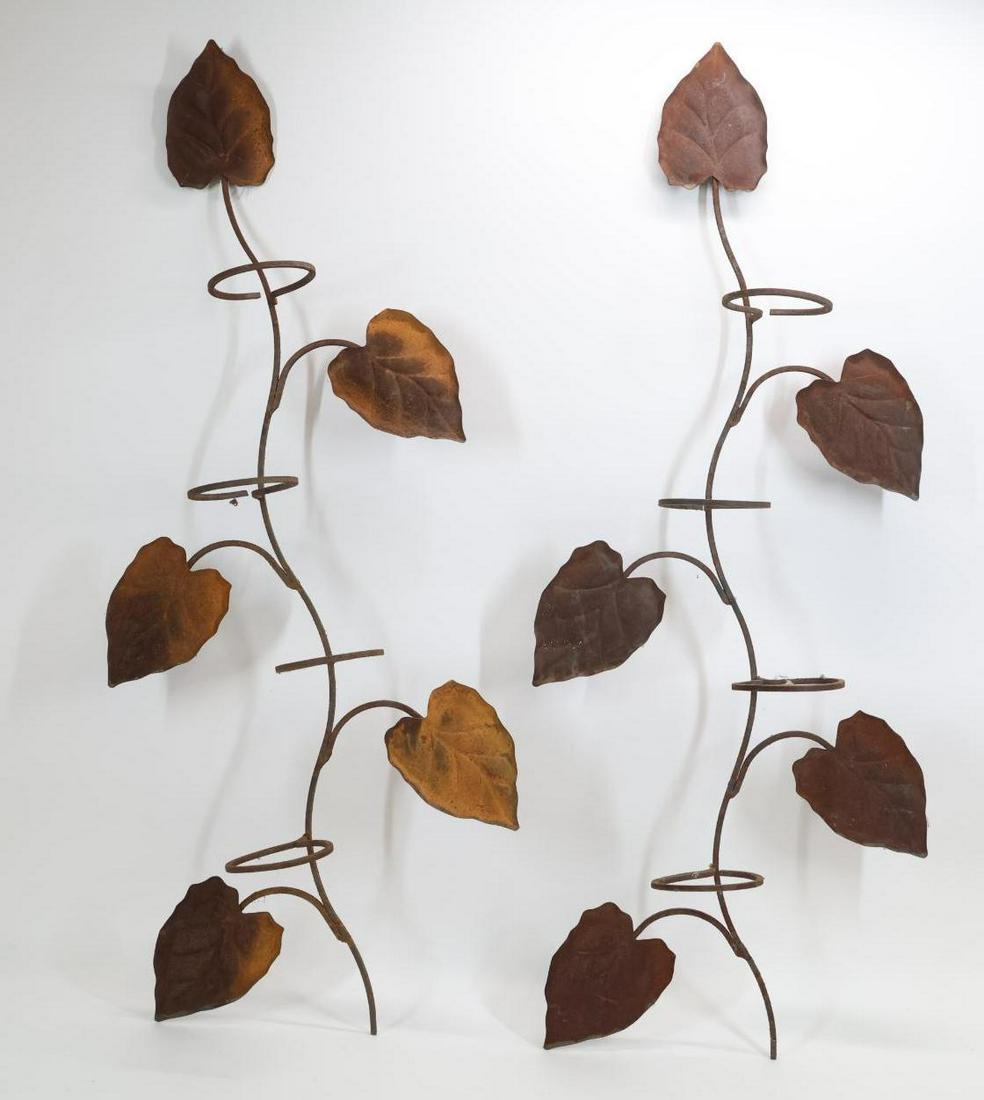 Manner of John Salterini Hanging Planters: Wrought iron pair of hanging planters in the form of espaliered trees, unmarked. Rusting. 45”h x 17"w x 6.5"d **Please Note: This item is NOT eligible for in-house shipping. Please refer to the