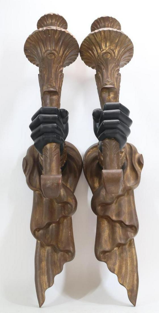 Blackamoor Arm Wall Sconces: Painted gesso on wood, pair of candle sconces, unmarked. 33"h **Please Note: This item is NOT eligible for in-house shipping. Please refer to the terms and conditions of this auction for recommended s