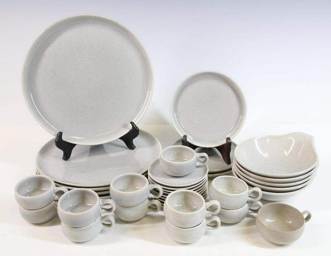 â€‹â€‹â€‹â€‹â€‹â€‹â€‹Russel Wright Dinnerware: Ceramic gray glazed, 34 pieces including plates, bowls, coffee cups and saucers. Largest plate 10" round **Please Note: This item is NOT eligible for in-house shipping. Please refer to the terms and c
