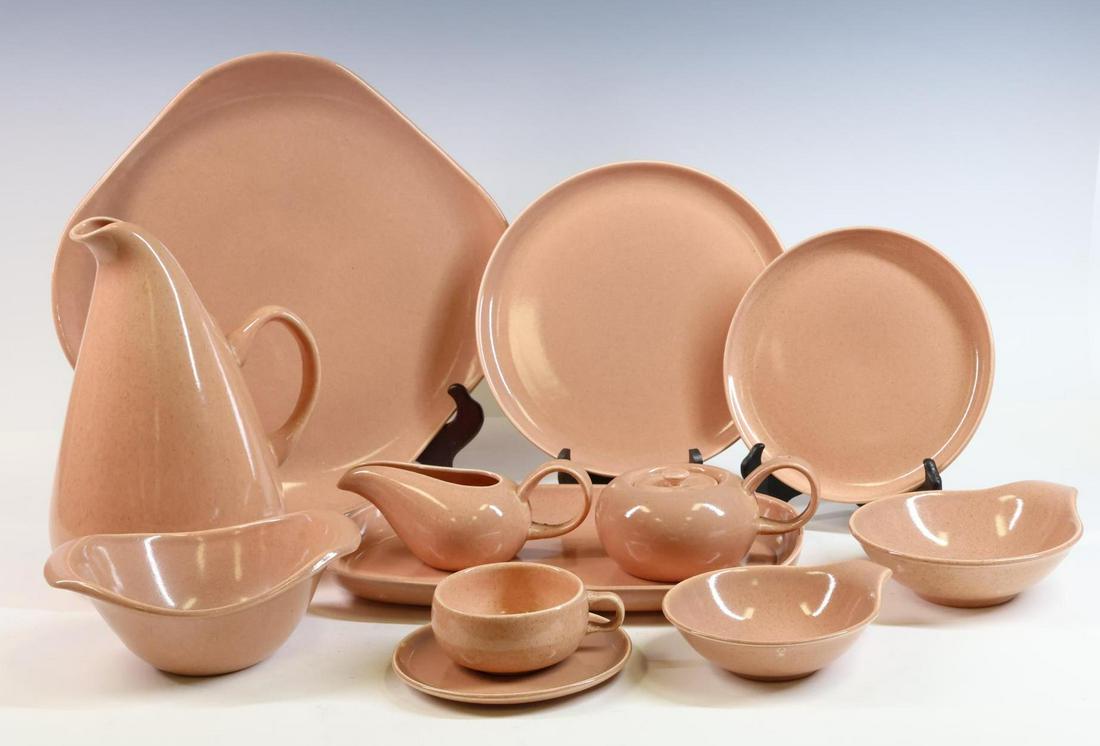 Russel Wright Serving & Dinnerware Pieces: Ceramic pink glazed, 51 pieces including pitchers, serving plates, bowls and coffee cups and saucers. Largest pitcher 11"h **Please Note: This item is NOT eligible for in-house shipping. Please refer