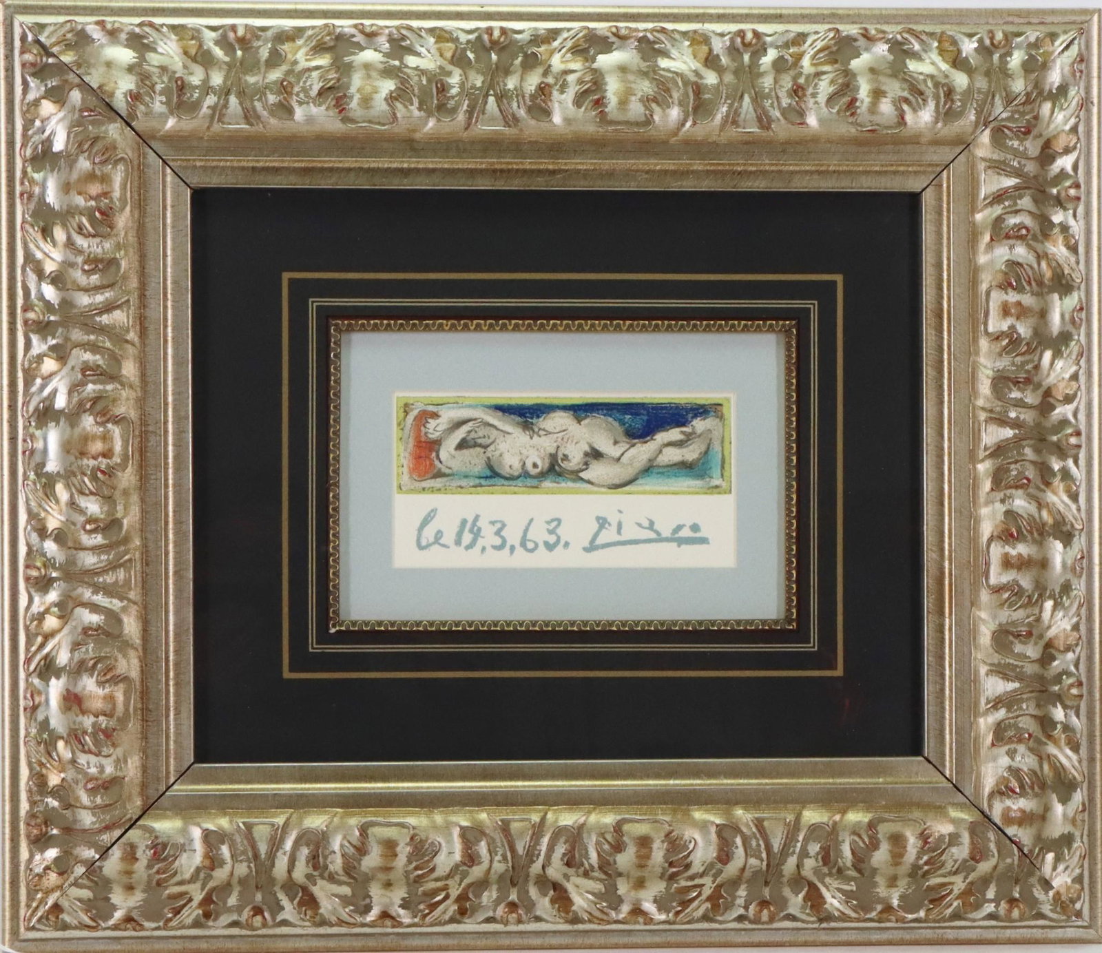 Pablo Picasso (1881 - 1973): Lithograph titled "Femme Nue Couchee". 3.5”h x 6.5”w sight and 18”h x 21”w framed