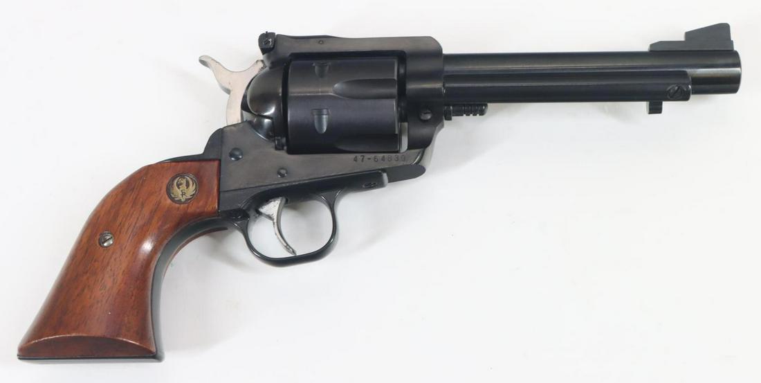 Ruger New Model Blackhawk Single Action Revolver: 45, 5 1/2" bbl, SN 47-64830. 98% blue finish shows average handling with a few scattered freckles and small scratches around cylinder center pin and underside of ejector rod shroud, good bore, adjusta